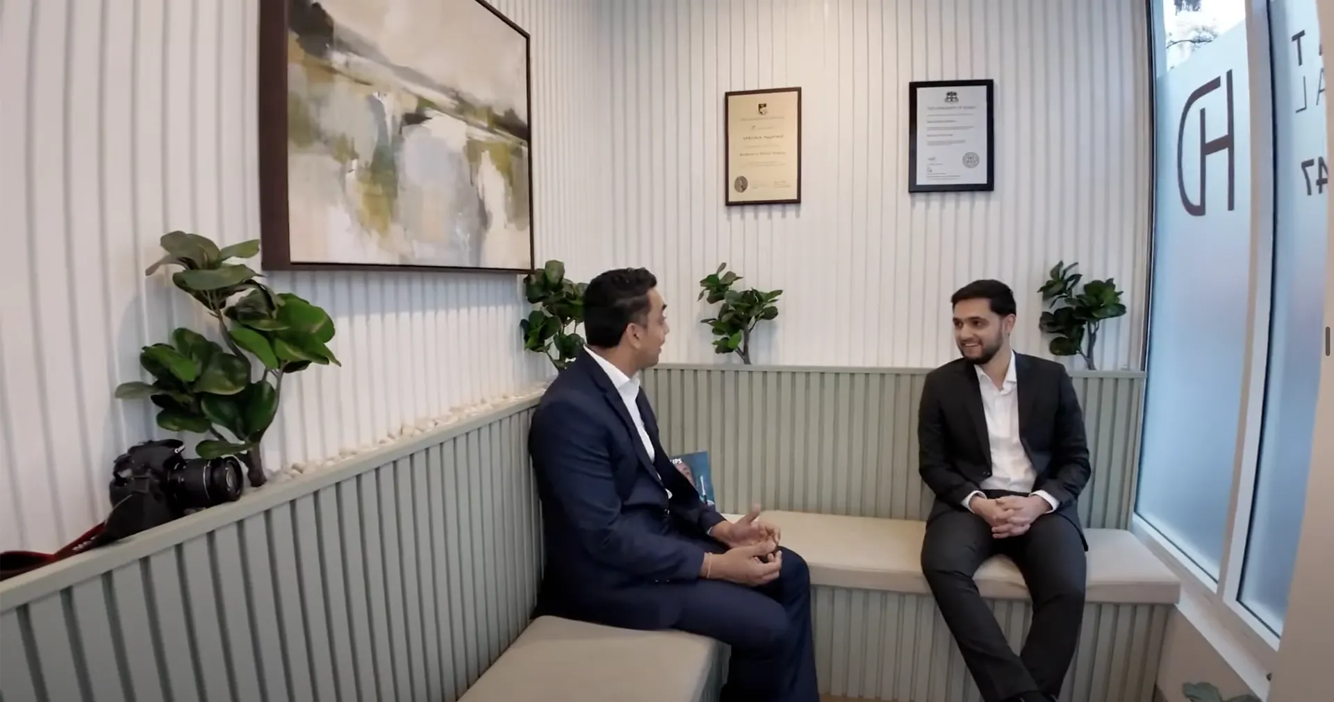 Dr Abhishek talking with a patient in the waiting area